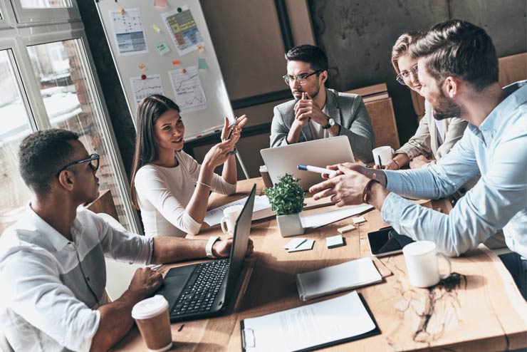 students meeting during business management school