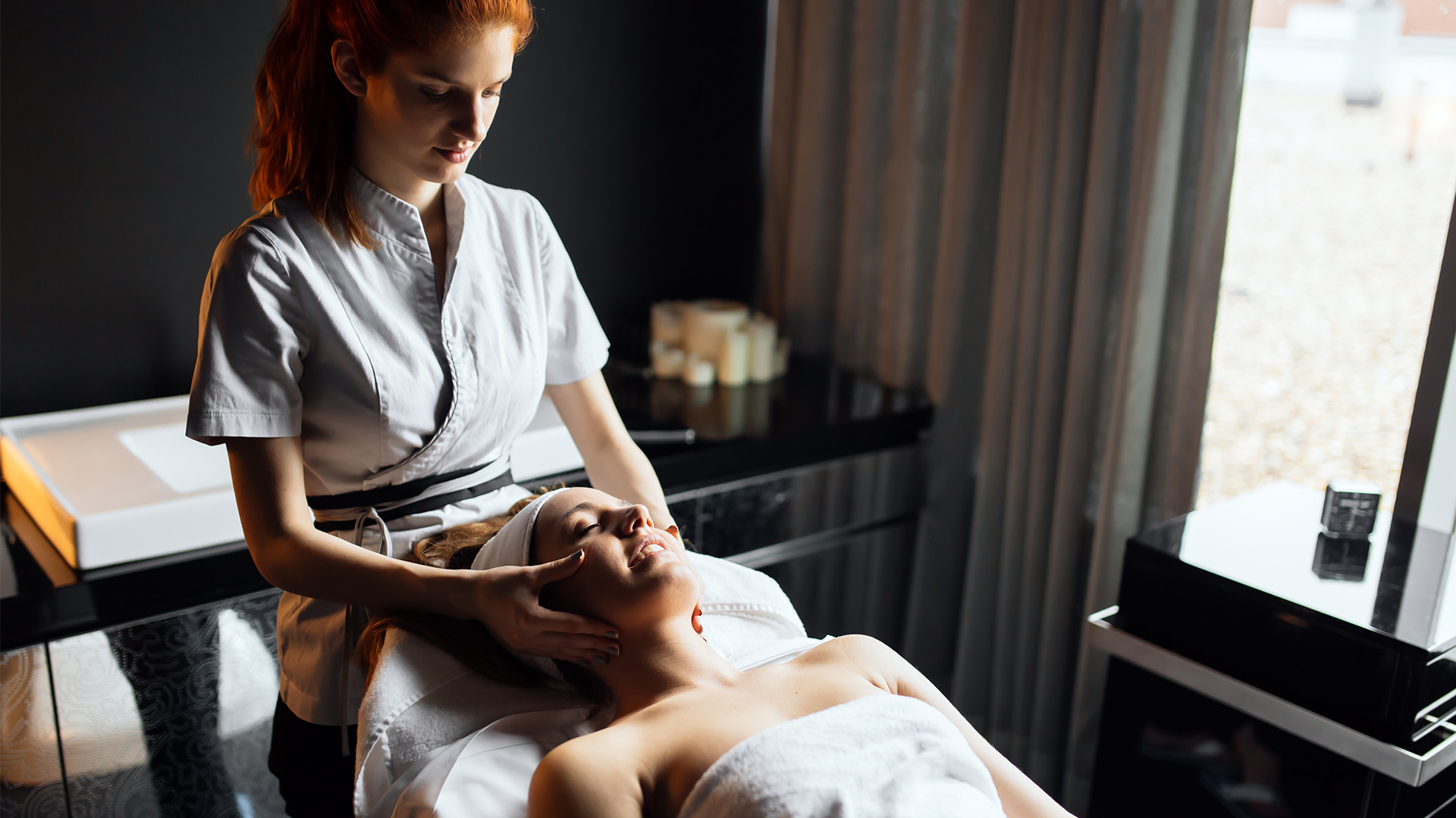 Massage therapist giving a massage to a client